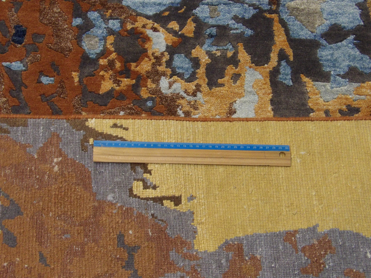 Brown and multi-color Tibetan rug in room setting
