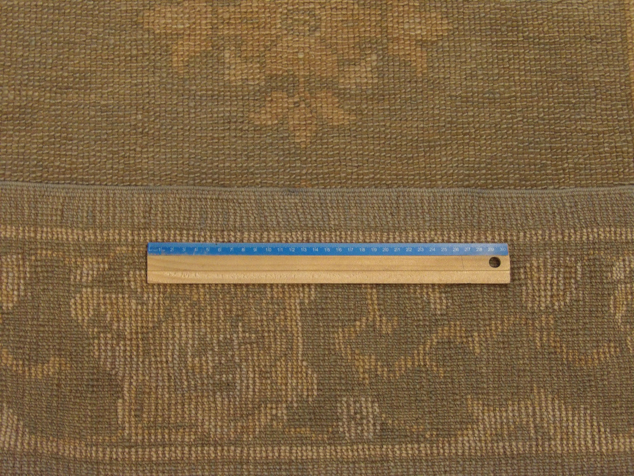 Soft blue and green Oushak runner in hallway setting