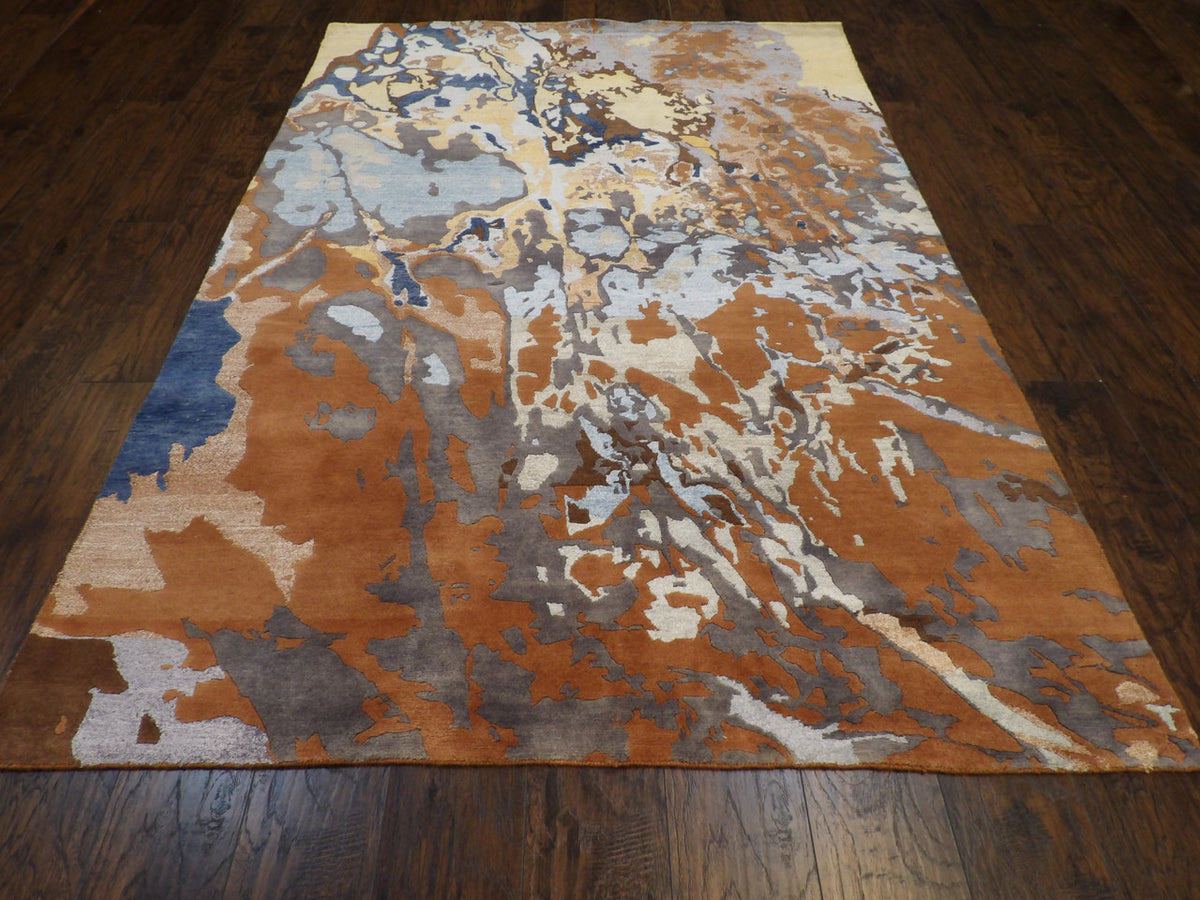 Close-up of carved wool texture, brown and multi-color rug