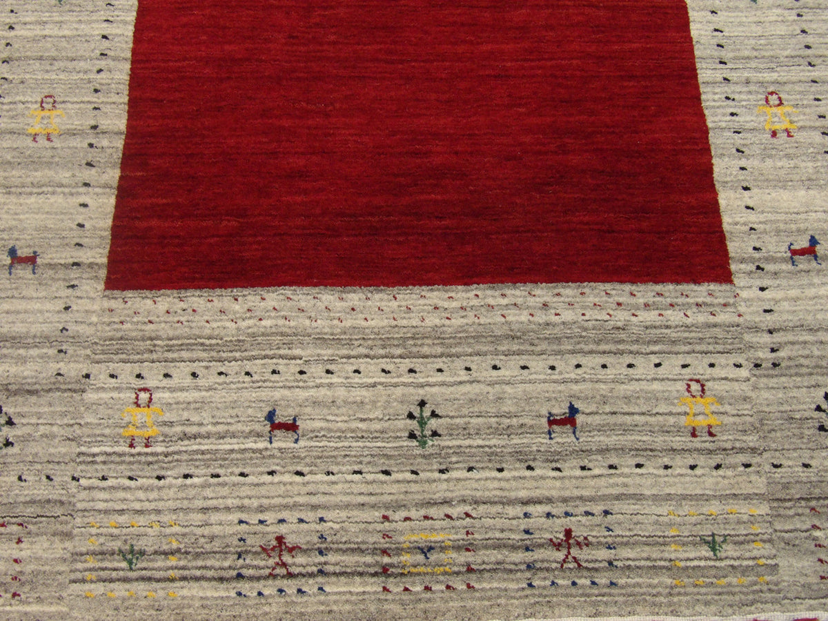 Gabbeh wool texture close-up, beige and red