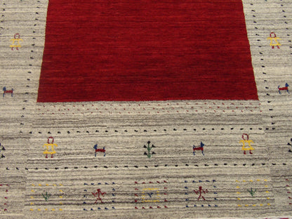 Gabbeh wool texture close-up, beige and red