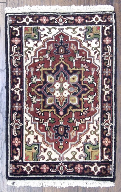 Tribal Heriz hand-knotted wool rug in Black & Red, full view