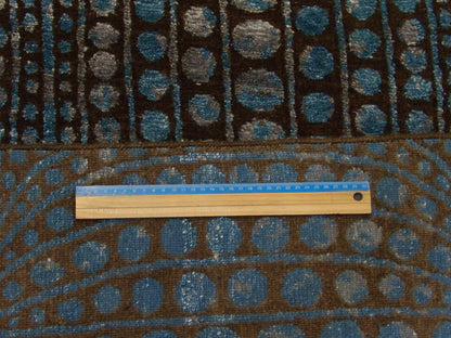 Blue and brown Arts and Crafts rug in room setting