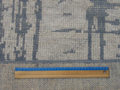 Full room view of transitional abstract hand-knotted rug
