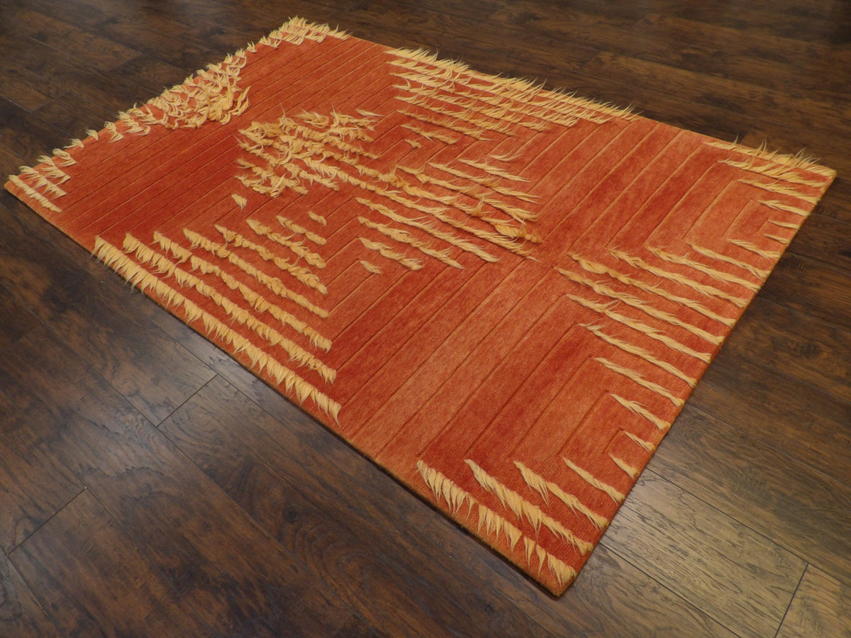 Gold and rust shag rug in a modern living room setting