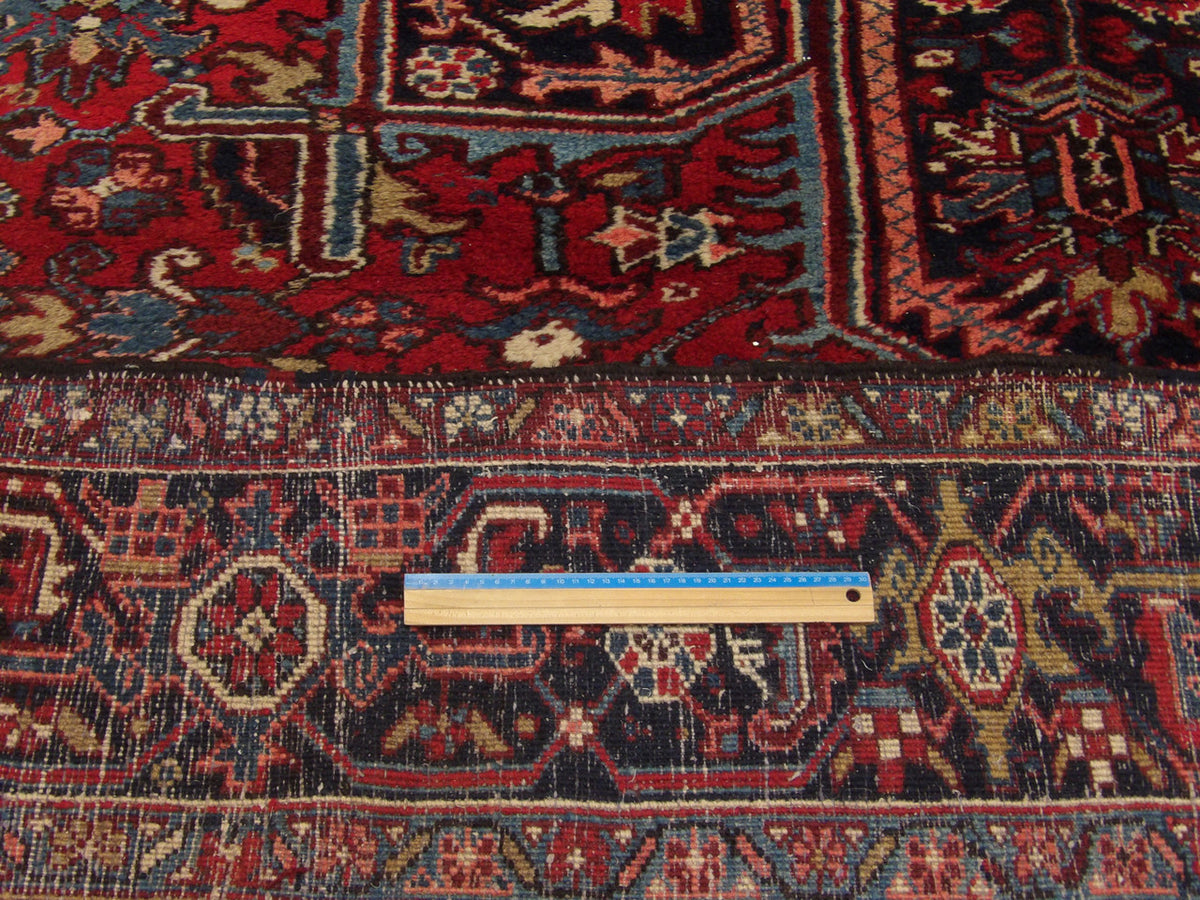 Blue and red Heriz rug in room setting