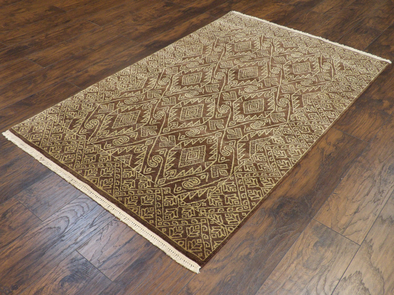 Ikat resist-dye pattern detail, beige and brown rug