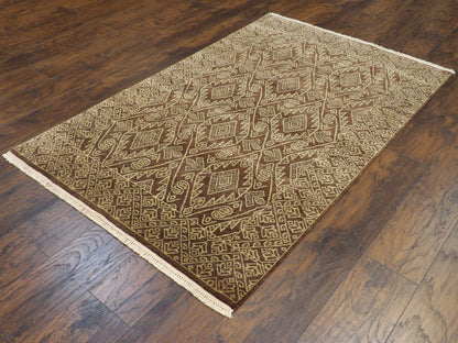 Ikat resist-dye pattern detail, beige and brown rug