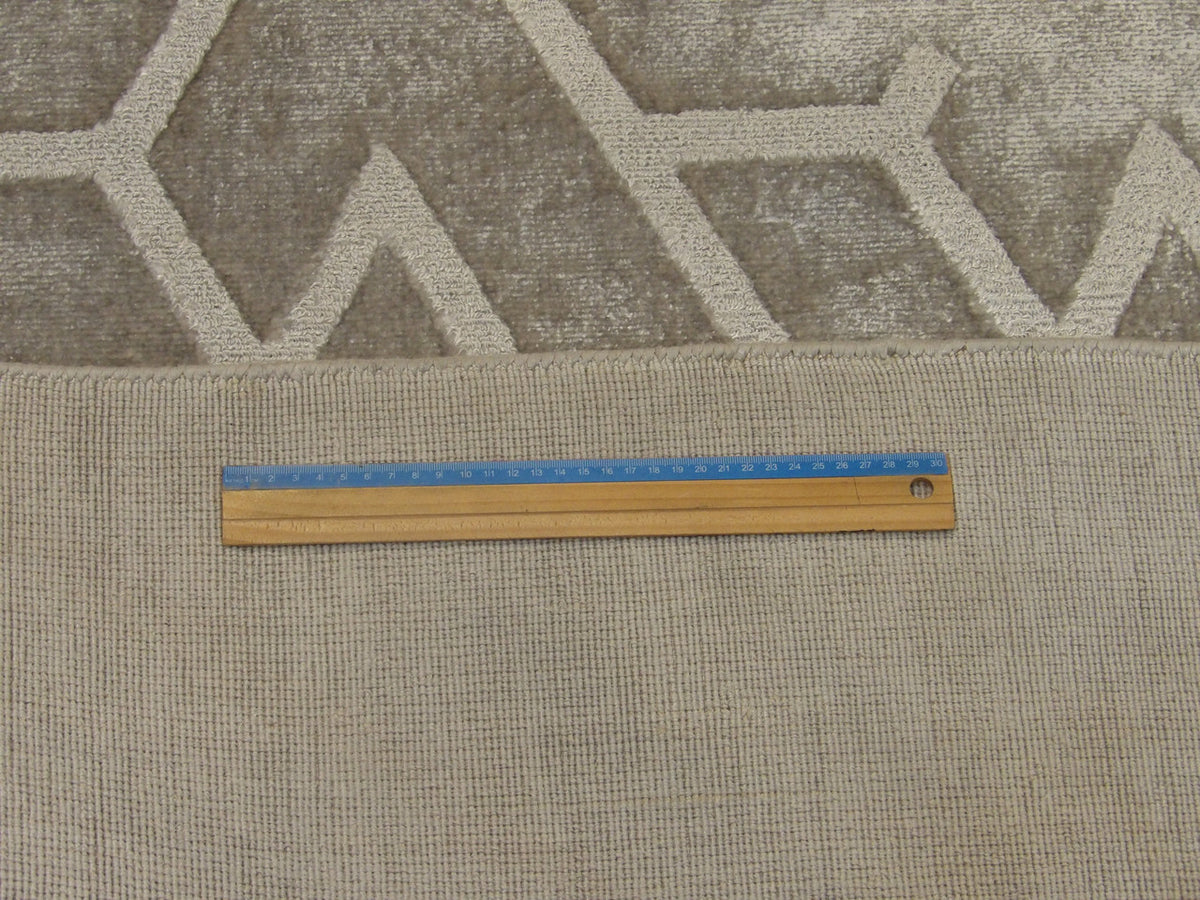 Full room view of transitional silky broken design rug