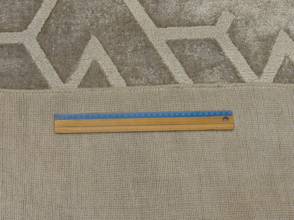 Full room view of transitional silky broken design rug