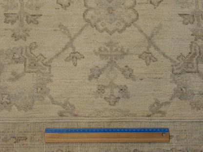 Beige Oushak Chobi Wash rug in room setting