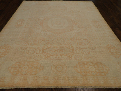 Close-up of wool pile, beige and rust rug