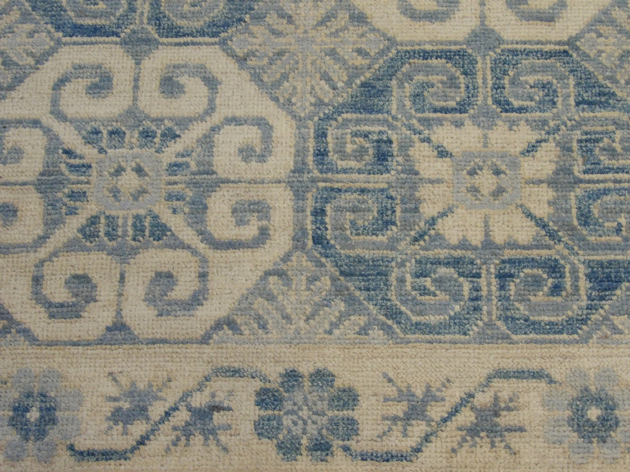 Tribal Khotan rug border detail