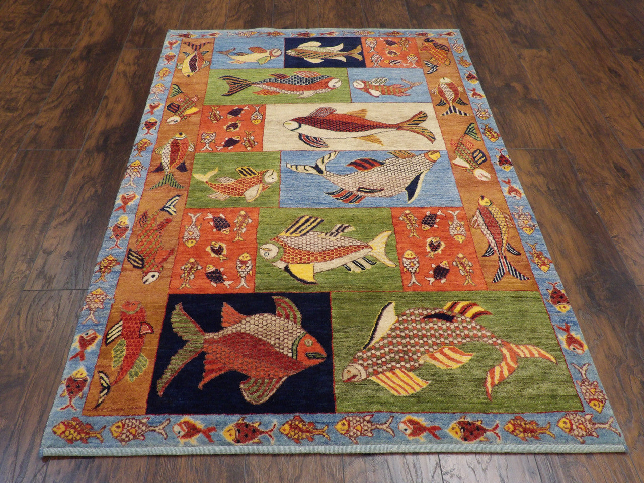 Close-up of wool pile, blue and rust coastal rug