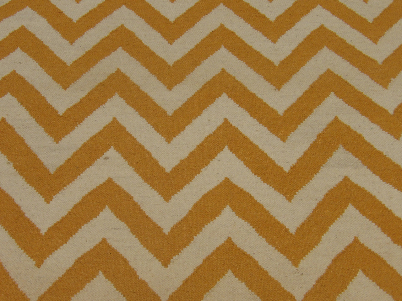 Coastal rug edge detail, gold and white