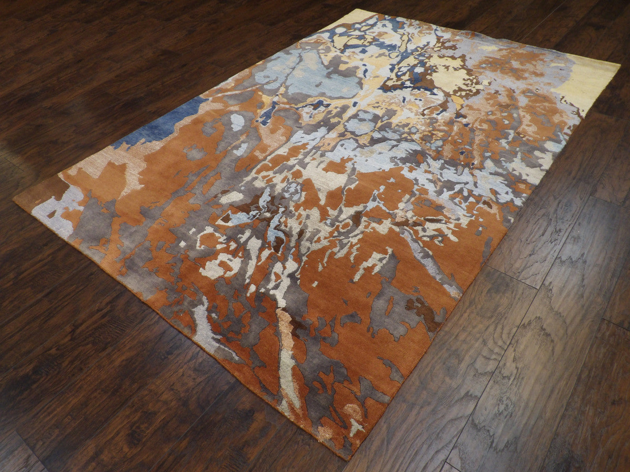 High-low pile pattern detail, brown rug