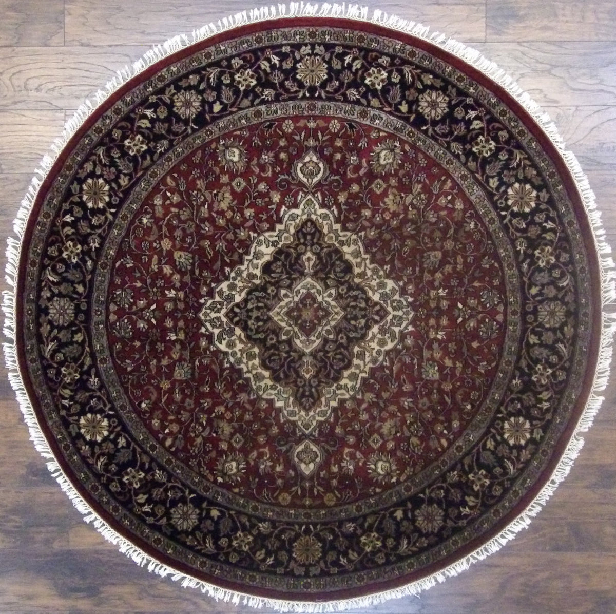 Fine Persian Tabriz hand-knotted wool round rug in black, full view