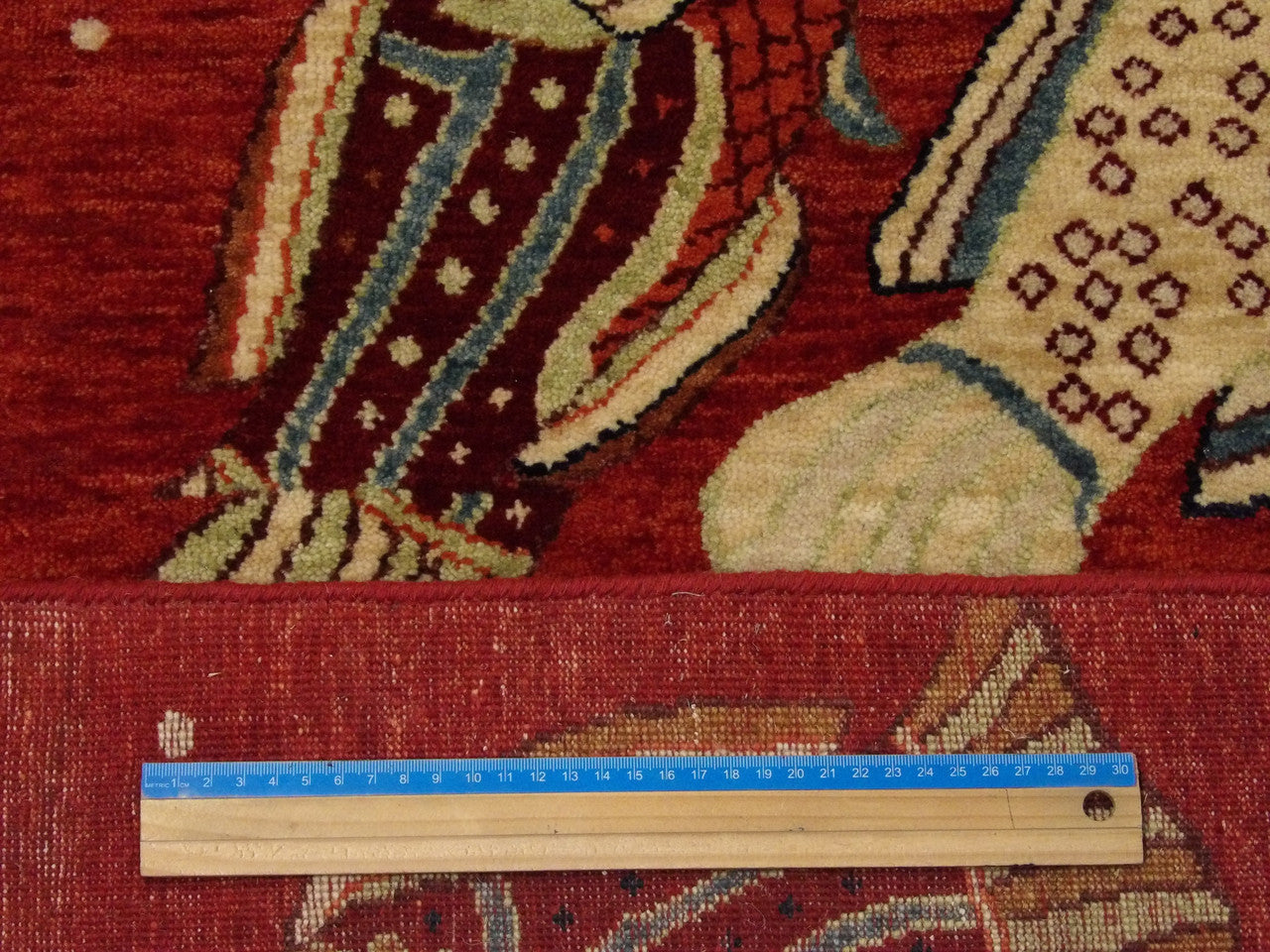 Red fish design rug in room setting