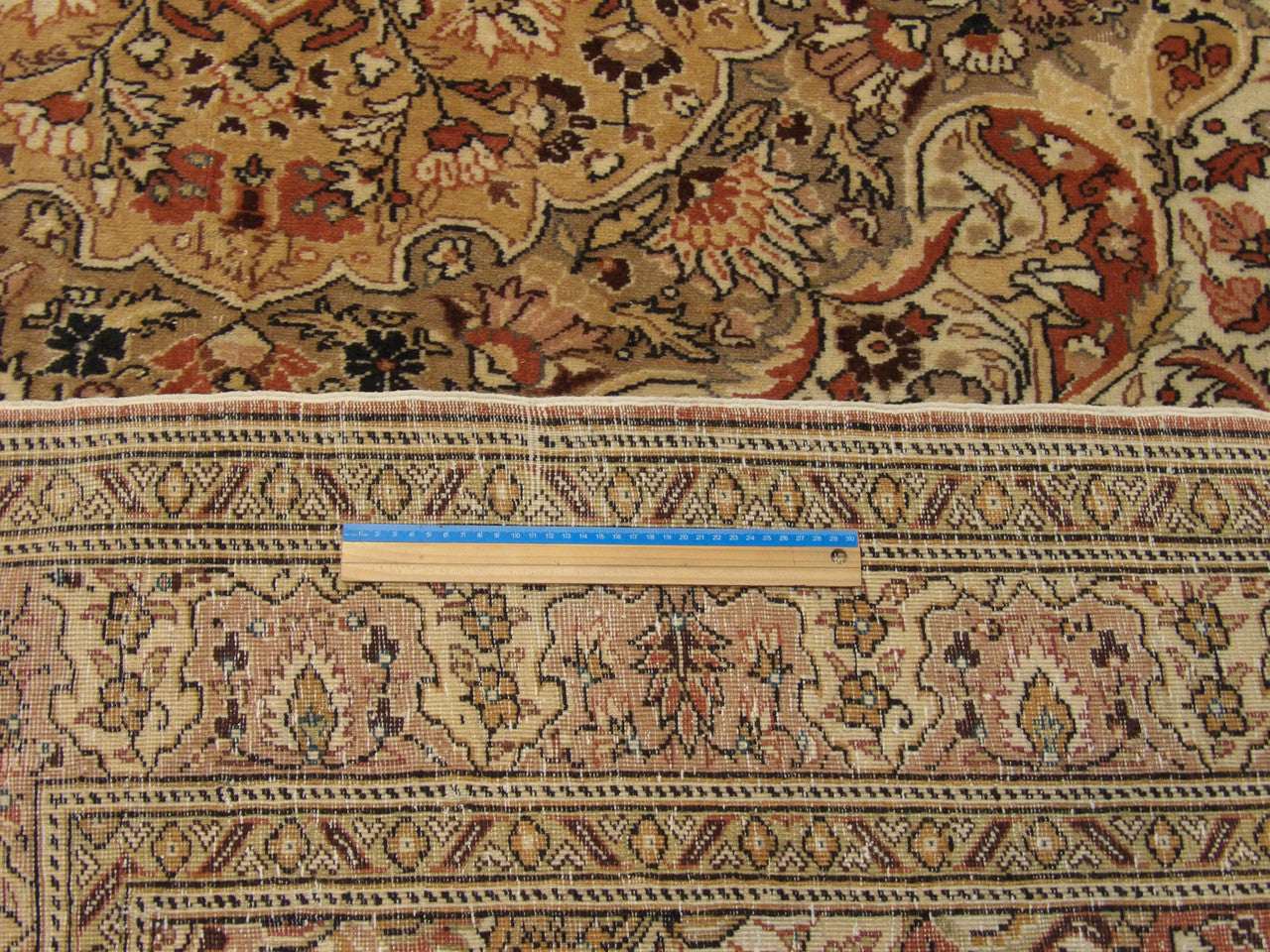 Beige & Pink Antique Turkish Hereke rug in room setting