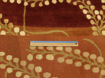 Gold & Rust Tibetan Carved French Leaves Design rug in room setting