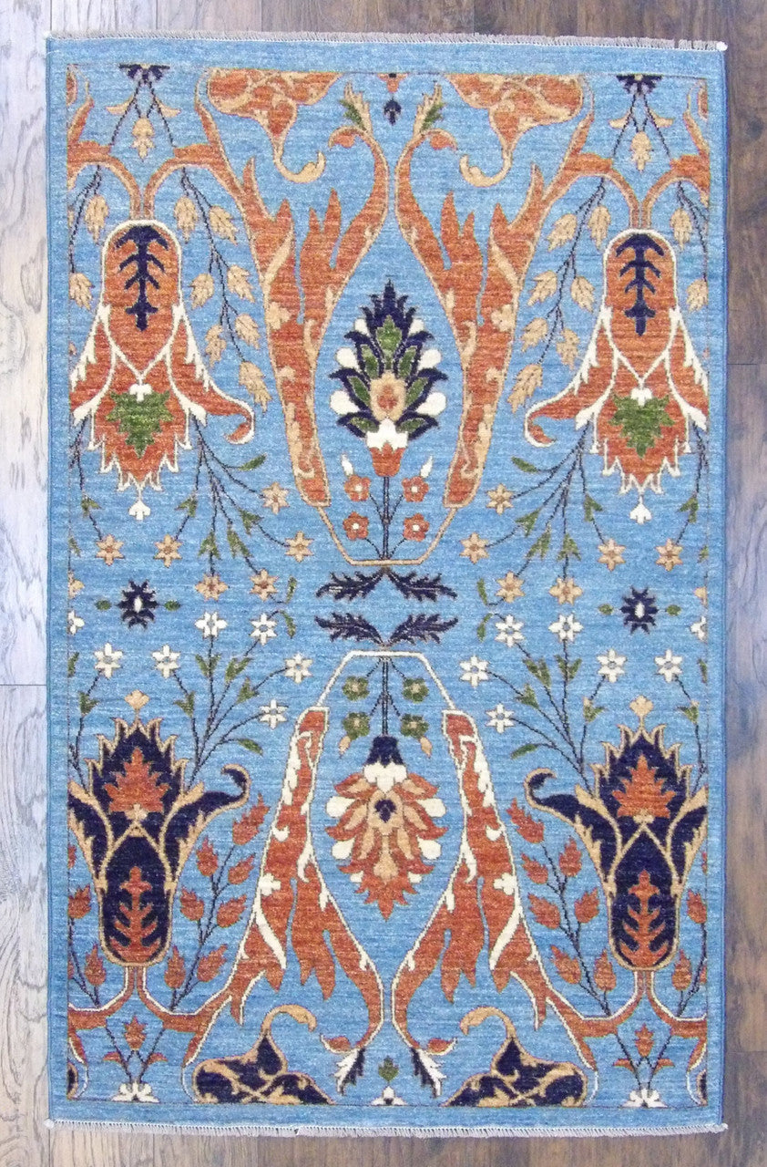 Transitional Ikat Design Natural Dye hand-knotted wool rug in Blue & Rust, full view