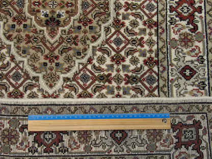 Persian Mahi Tabriz rug corner detail
