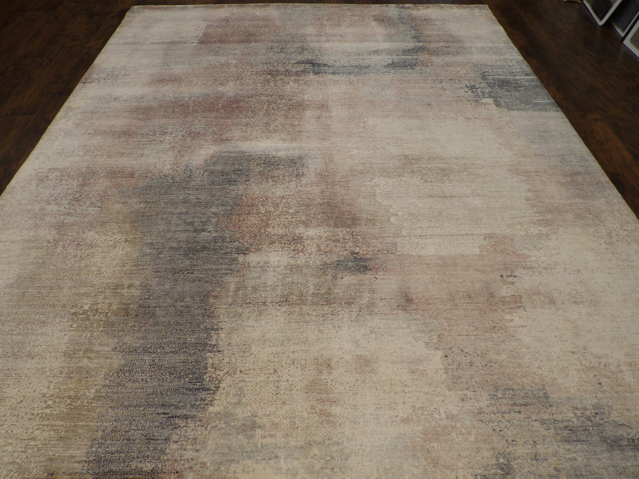 Close-up of wool-silk pile, gray and pink rug