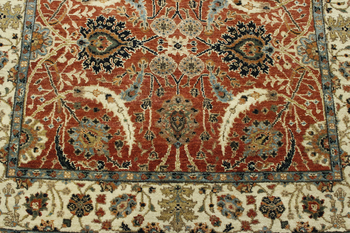 Beige & Red Traditional Fine Haji Jalili rug in room setting