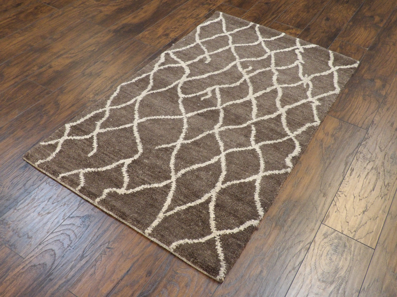 Moroccan pattern detail, brown rug