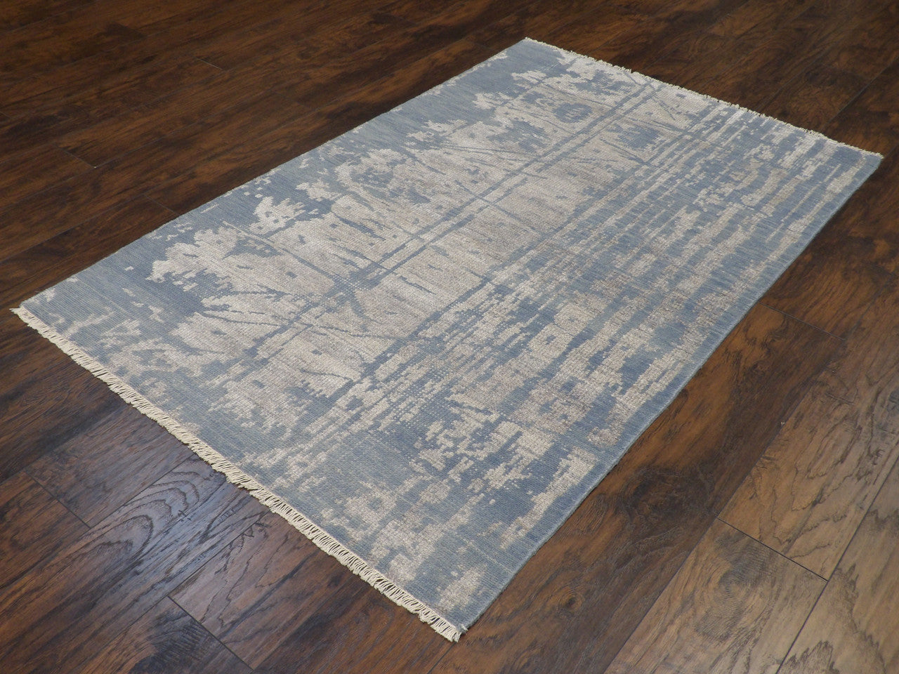 Abstract pattern detail, blue and gray rug