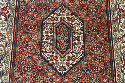 Beige & Red Traditional Indo Bidjar rug in room setting