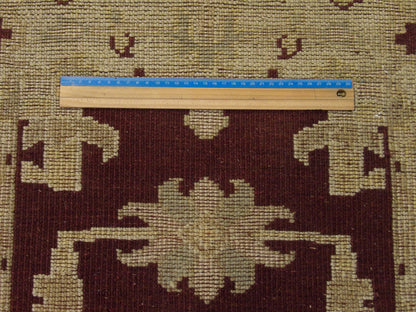 Brown and beige Oushak rug in room setting