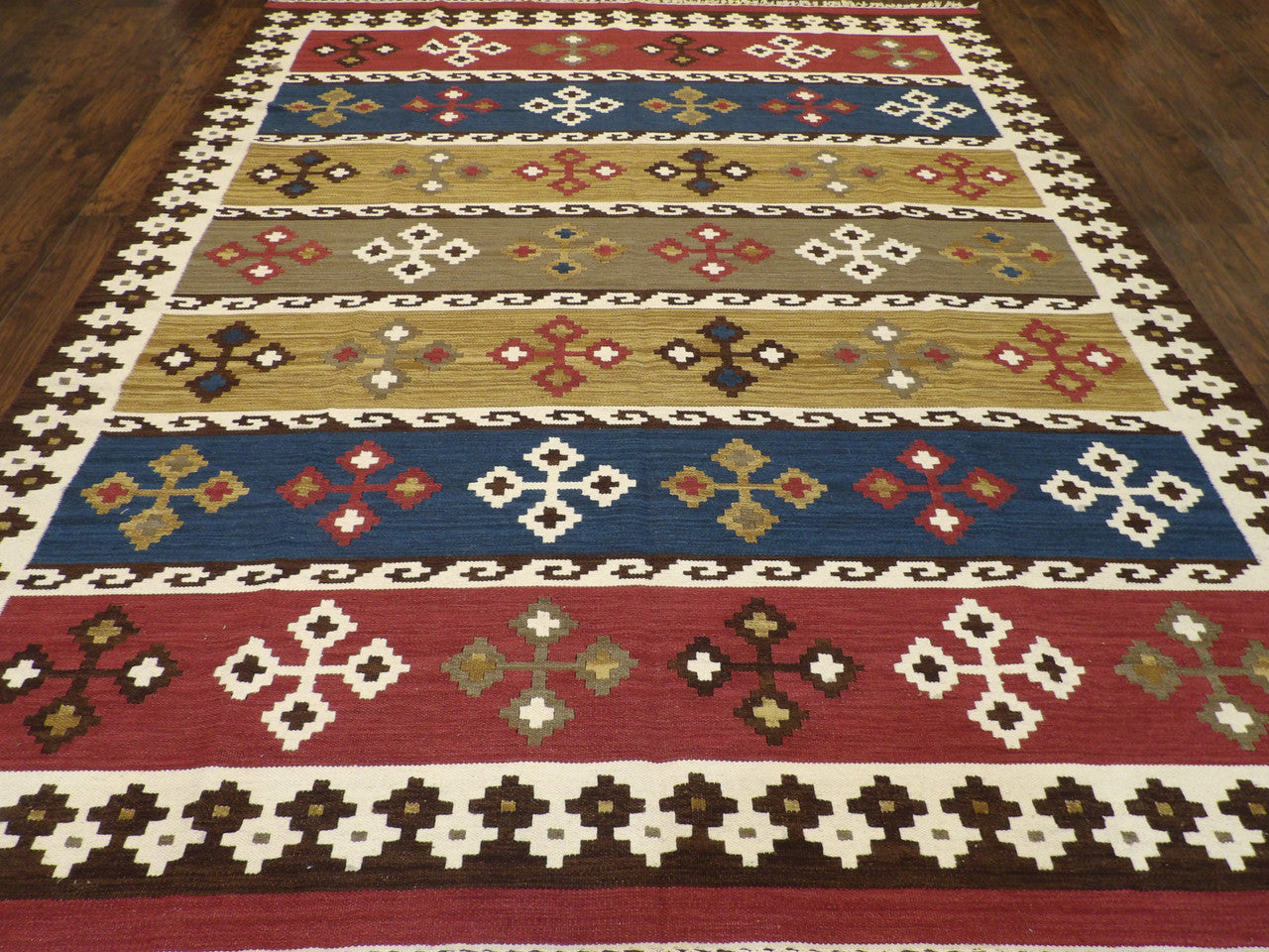 Back of hand-knotted coastal rug showing reversible weave