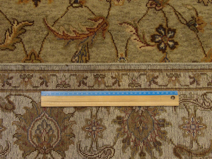 Green and ivory Ziegler rug in room setting