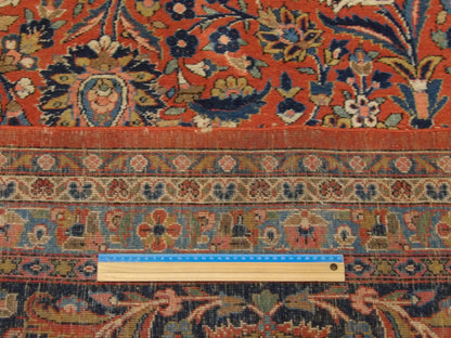 Blue and red antique Tabriz rug in room setting