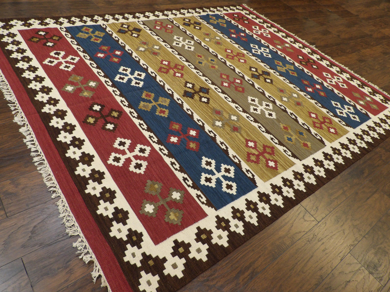 Multi-color coastal flatweave rug in a patio setting