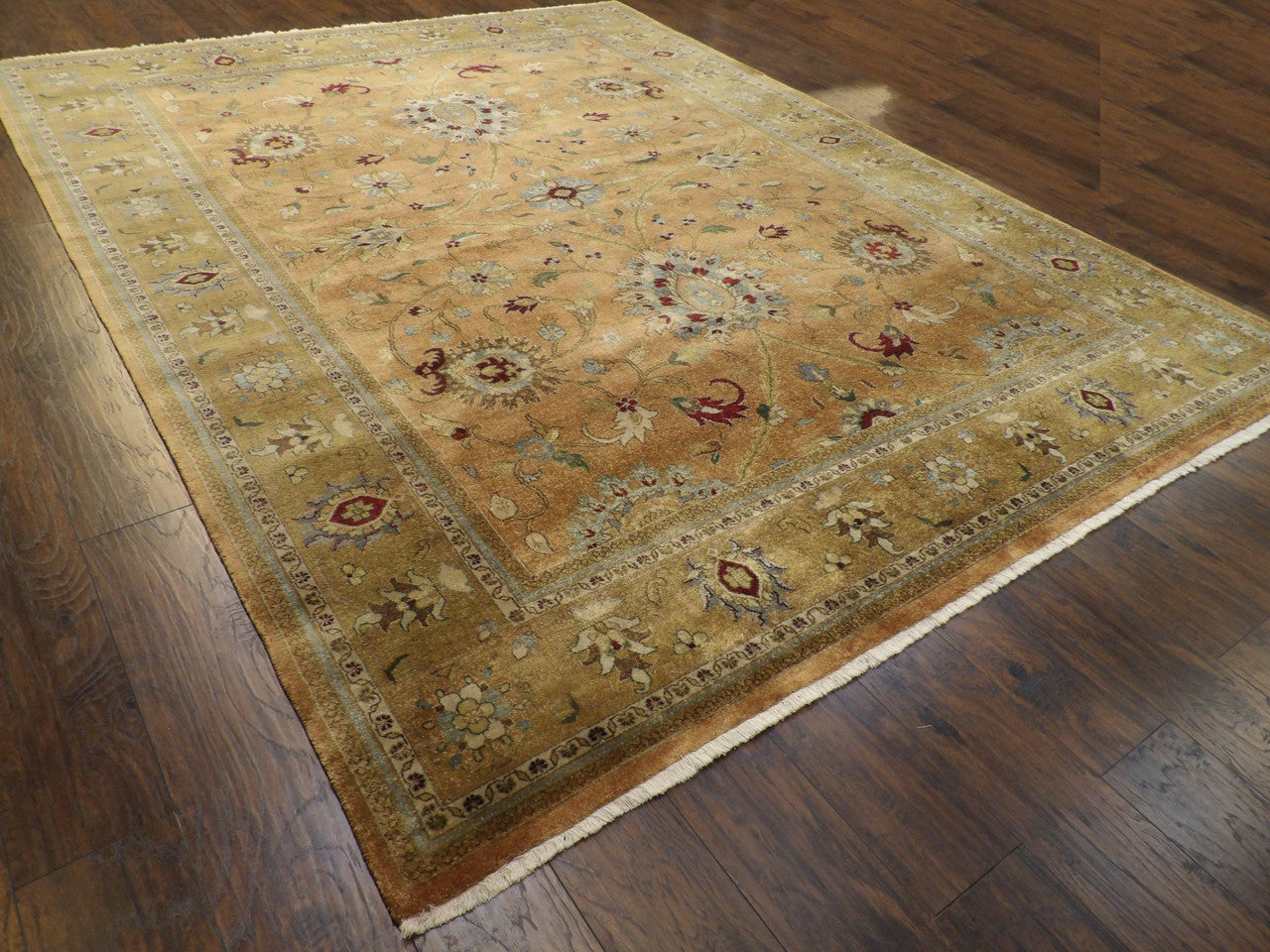 Beige Ziegler rug in a formal room setting