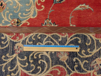 Blue & Red Fine Persian Tabriz rug in room setting