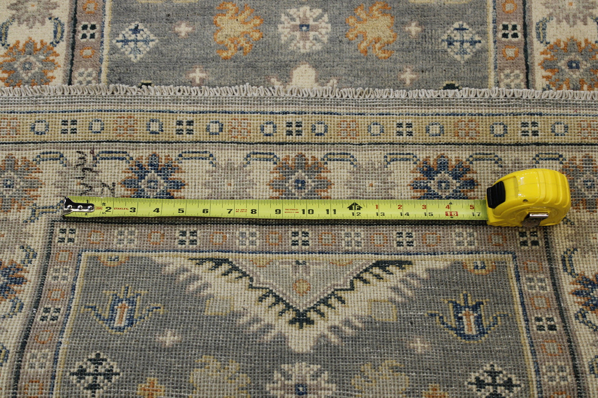 Blue Tribal Super Kazak rug in room setting