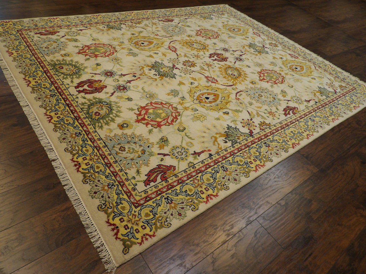 Ziegler pattern detail, gold and ivory colorful rug