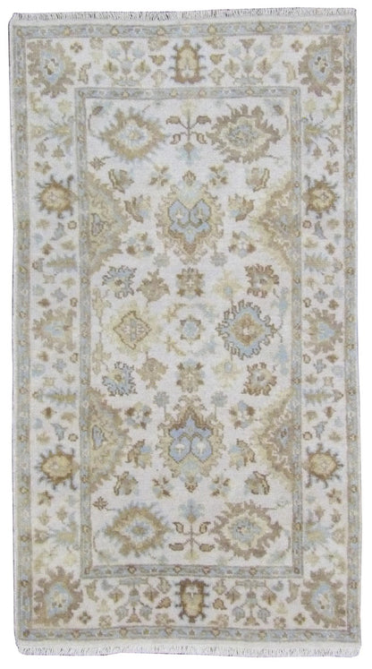 Oushak hand-knotted wool rug in Ivory, full view