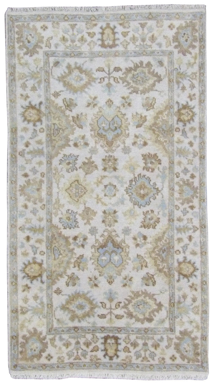 Oushak hand-knotted wool rug in Ivory, full view