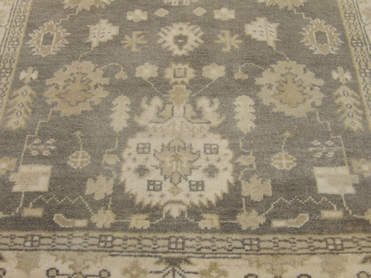 Back of Oushak hand-knotted rug