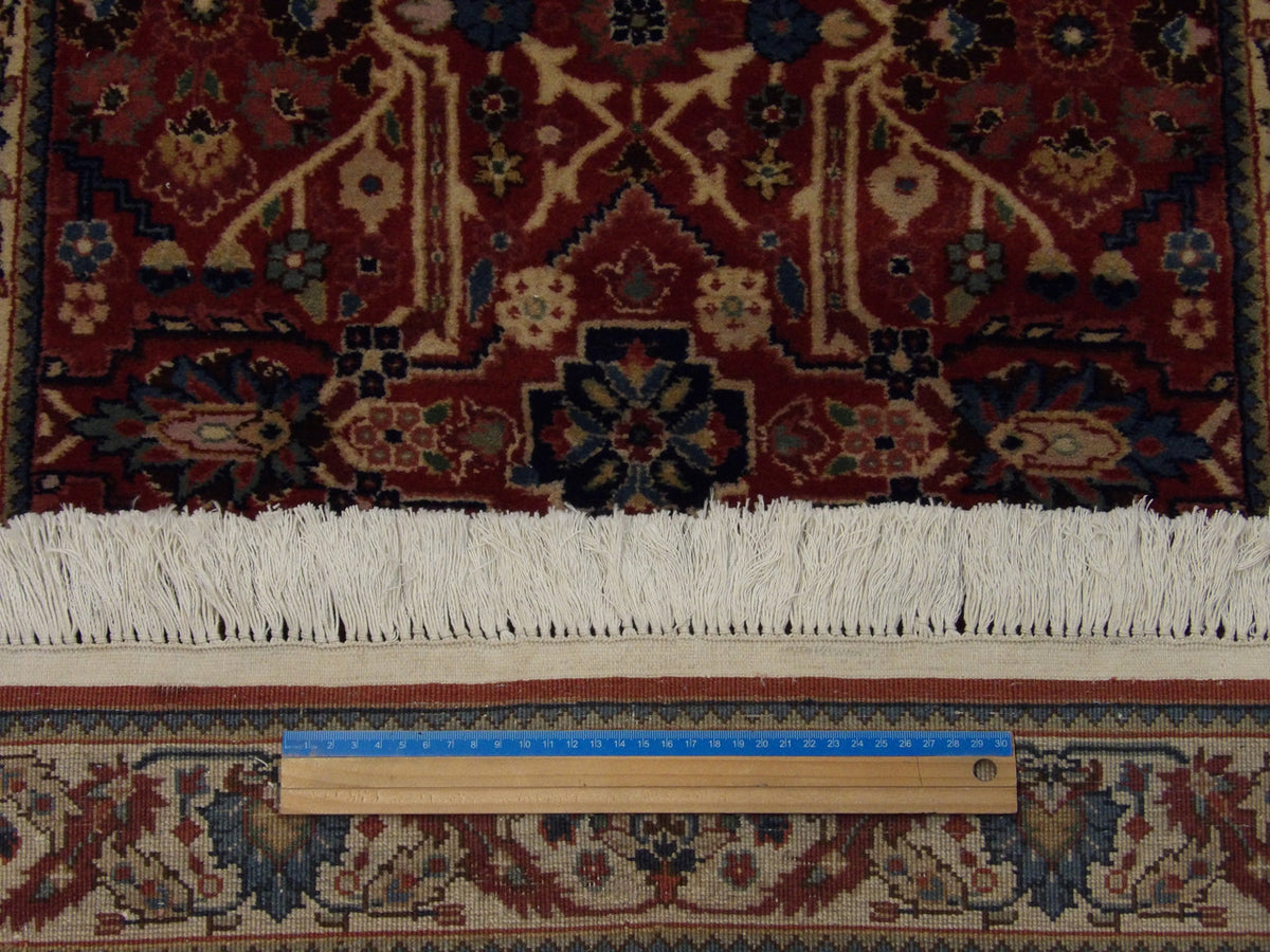 Beige and red Herati runner in hallway setting