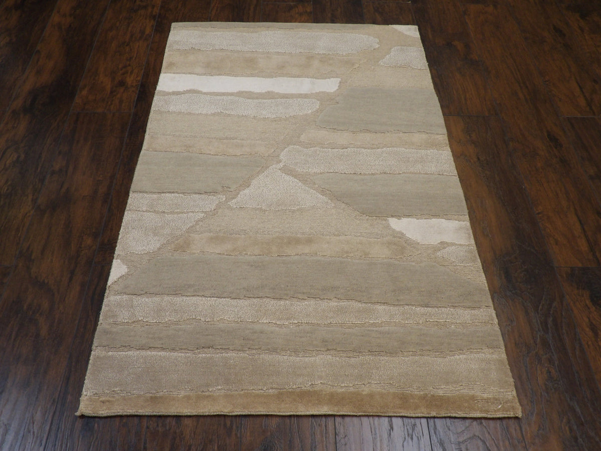 Close-up of wool-silk pile, gray and beige rug