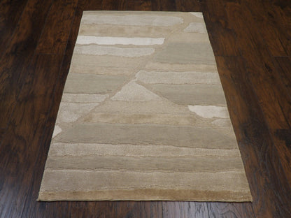 Close-up of wool-silk pile, gray and beige rug