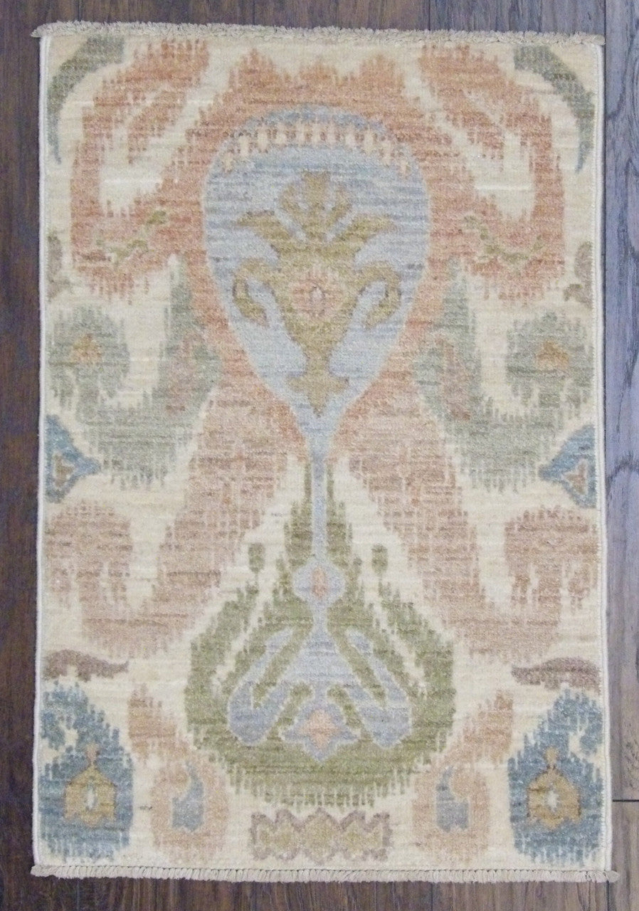 Ikat Chobi hand-knotted wool rug in blue and ivory, full view
