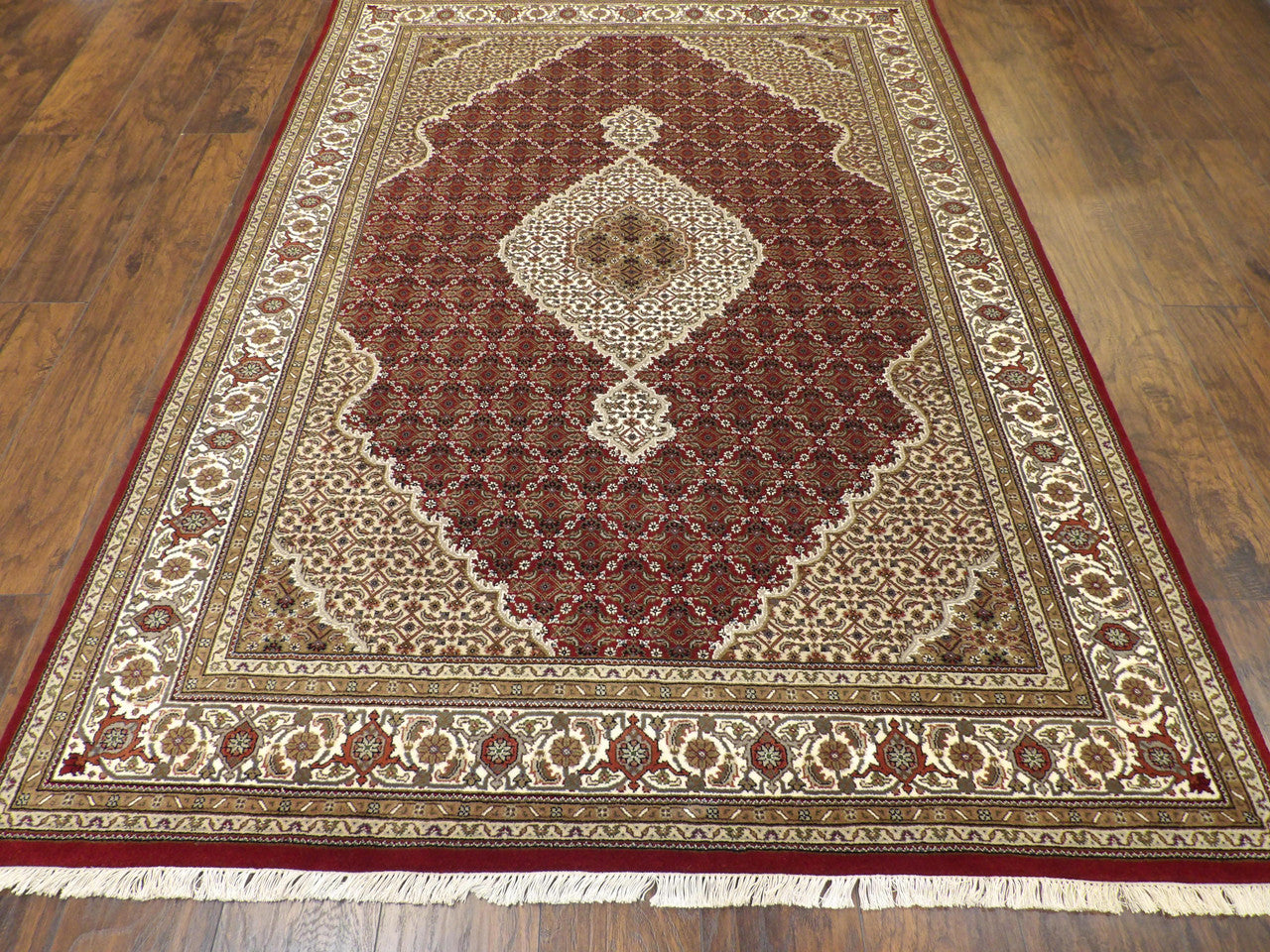 Back of hand-knotted Mahi Tabriz rug showing construction