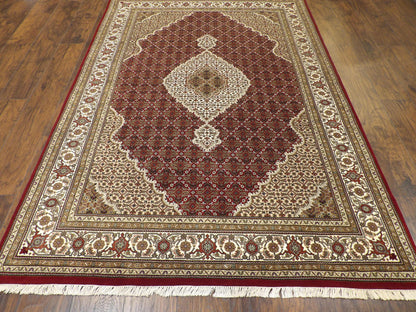 Back of hand-knotted Mahi Tabriz rug showing construction