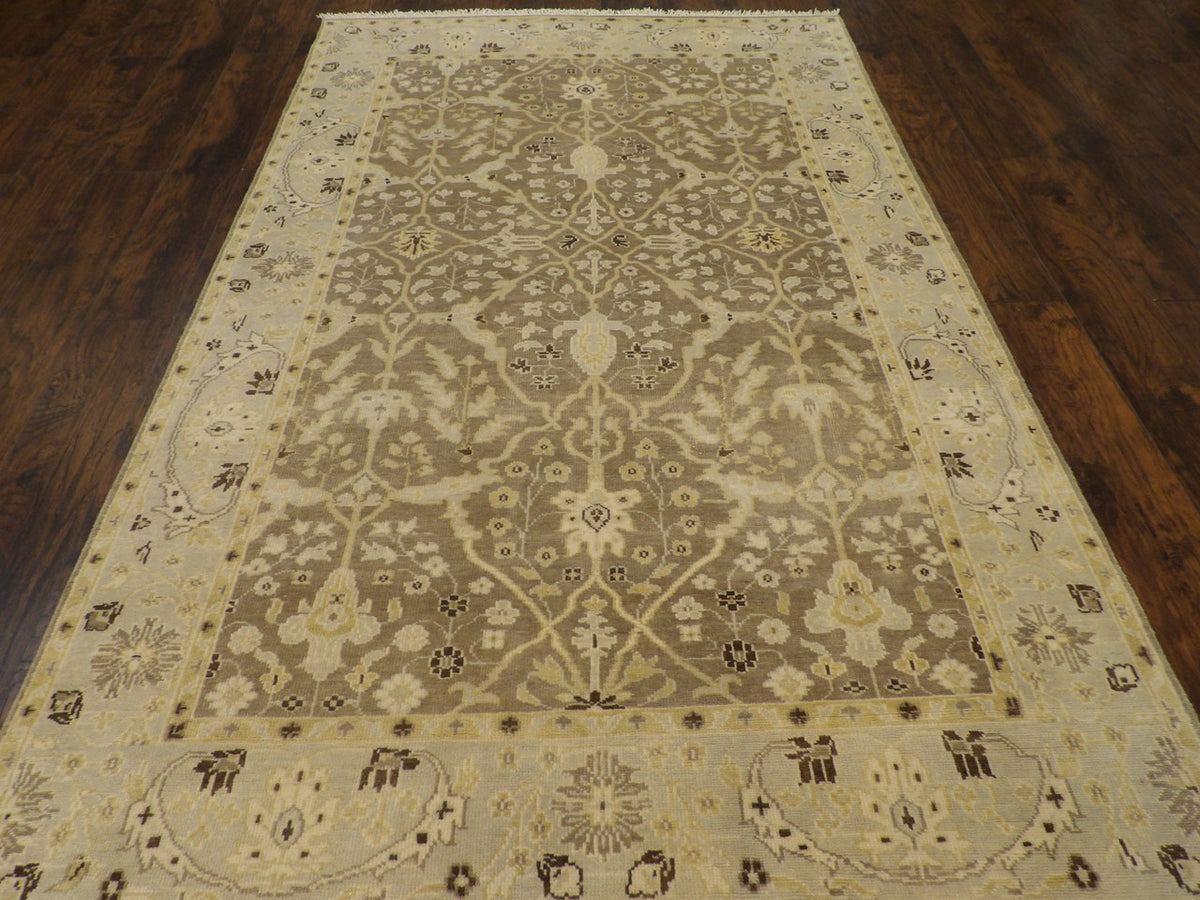 Close-up of wool pile, brown and gold rug